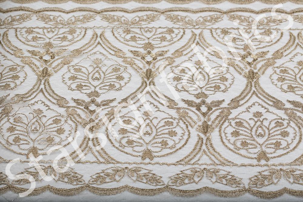 Symmetrical Embroidered Fabric with Decorative Embellishments