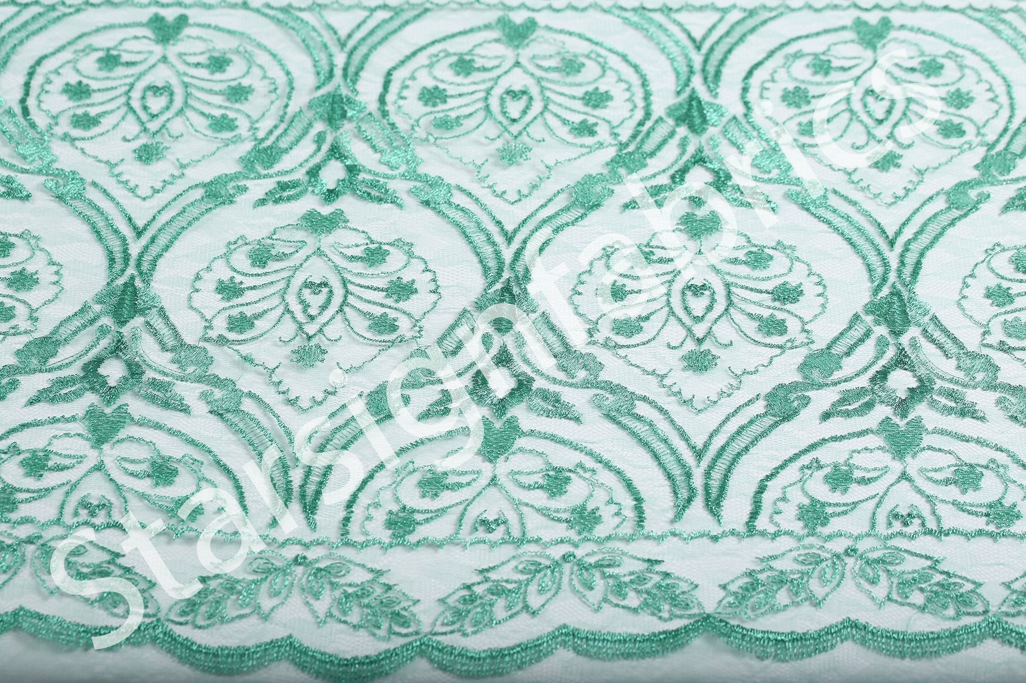Symmetrical Embroidered Fabric with Decorative Embellishments